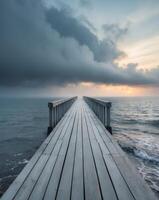 Moody Skies Over a Peaceful Pier Extending into the North Sea photo
