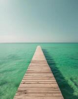 Wooden Dock Leading to Tranquil Emerald Waters photo