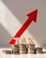 Tax concept with red arrow and stacks of coins on white background photo