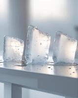 Three ice cubes sitting on a table photo