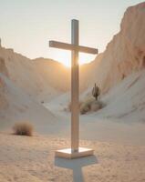 A cross stands in the desert at sunset photo