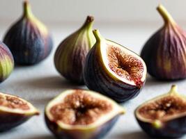 Figs are cut in half and arranged on a table photo