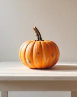 A pumpkin sitting on a table with a white background photo