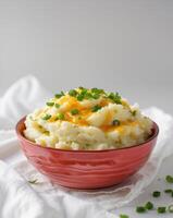 Mashed potatoes with cheese and chives photo