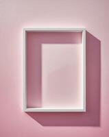 a white frame on a pink background with a shadow photo