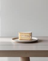 there is a piece of cake on a plate on a table photo