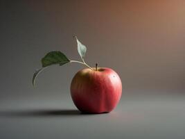 A Red Apple With A Single Green Leaf Rests On A Surface photo