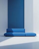 A blue couch with a black wall behind it photo