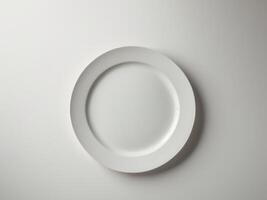 Empty white plate on a table photo