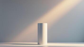 A white cylinder on a table in front of a wall photo