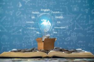 Online learning concept, language translation app, language courses. Light bulb placed on a book with foreign language translation on the website. Ai translation program photo