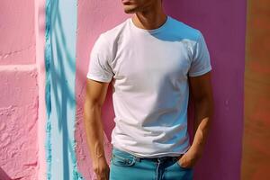Young man wearing bella canvas white shirt mockup, at colorful background. Design tshirt template, print presentation mock-up. photo