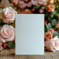Empty white card mockup against the background of flowers, romantic mood photo