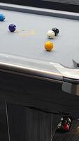 A pool table with a few balls on it video