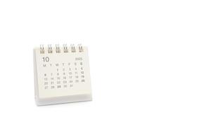Simple desk calendar for OCTOBER 2025 isolated on white background. Calendar concept with copy space. 2025 OCT calendar. photo