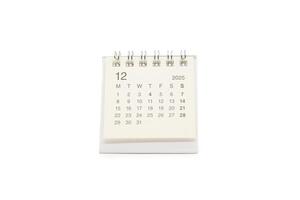 Simple desk calendar for DECEMBER 2025 isolated on white background. Calendar concept with copy space. 2025 DEC calendar. photo