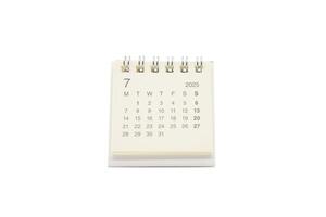 Simple desk calendar for JULY 2025 isolated on white background. Calendar concept with copy space. 2025 JUL calendar. photo