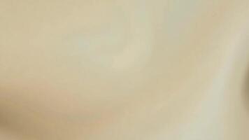 Abstract background with subtle light beige and cream color gradient with a soft, blurred, wavy texture. video