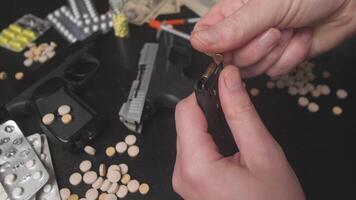 A stark depiction of addiction involving pills and firearms, vividly illustrating a troubling and dark reality video