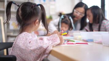 Portrait of children doing learning activities in the classroom video