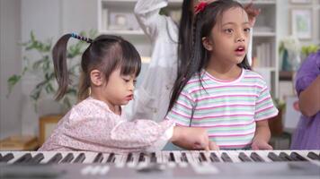 A group children doing activities singing and dancing in the classroom video