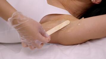 Close Up of Professional Underarm Waxing Treatment in Clean Setting video