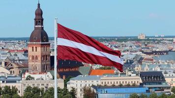 Latvian Flag and Riga Cathedral with Cityscape in Background video