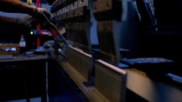 Close Up of Press Brake Machine with Gloved Hand in Industrial Setting video