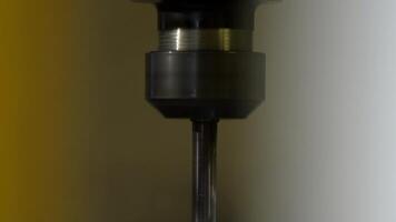 Close Up of Metal Drill Bit on Drill Press with Blurred Background video