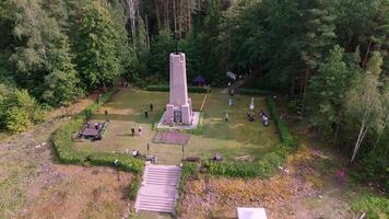 Monument with Emblem in Garden Setting with Event Gathering video