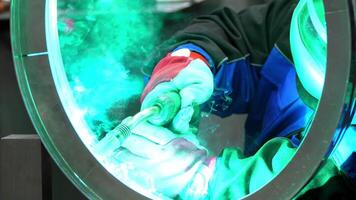Close Up of Welder at Work with Torch Inside Circular Opening video