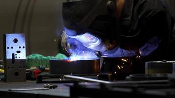 Welder at Work with Bright Sparks in Industrial Setting video