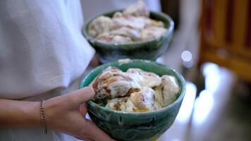 Close Up of Ceramic Bowls with Glazed Pastries in Indoor Setting video
