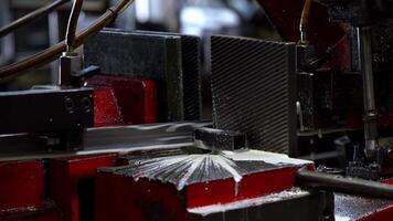 Close Up of Metalworking Machine in Operation with Red and Black Components video