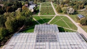 Aerial View of Geometric Greenhouse in Botanical Garden Setting video