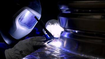 Welder at Work with Bright Torch and Protective Gear video
