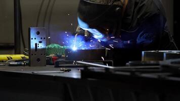 Welder at Work with Sparks Flying in an Industrial Setting video