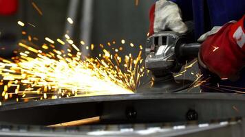 Close Up of Worker Using Angle Grinder in Industrial Setting video