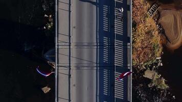 Aerial View of Bridge with Latvian Flags in Sigulda, Latvia video