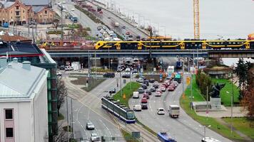Aerial View of Train Crossing Bridge in Urban Riga, Latvia video