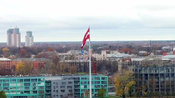 Aerial View of Riga Latvia with Prominent Latvian Flag and Cityscape video