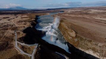 Gullfoss Waterfall with Rainbow and Snow Capped Mountains in Iceland video