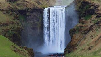 Skogafoss Waterfall Cascading Down Rugged Icelandic Cliff video