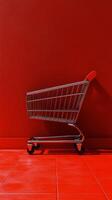 Empty shopping cart against a vibrant red background in a minimalistic setting photo