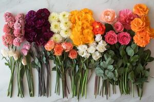 Colorful flower arrangement showcasing various blooms on a neutral backdrop photo