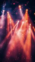 Bright stage lights illuminating colorful smoke during a live music performance at night photo