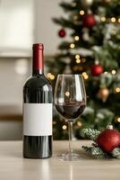 Festive wine bottle and glass near a decorated Christmas tree with warm lights photo
