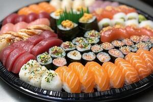 Colorful platter of assorted sushi rolls and sashimi for a special gathering photo