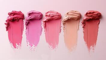 Various shades of lip color displayed on a smooth surface for beauty and cosmetics analysis photo