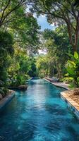 Serene green oasis featuring a tranquil swimming pool surrounded by lush nature photo